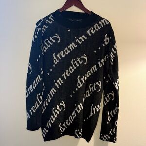 Stylish Black Crewneck Sweater with 'Dream In Reality' Design